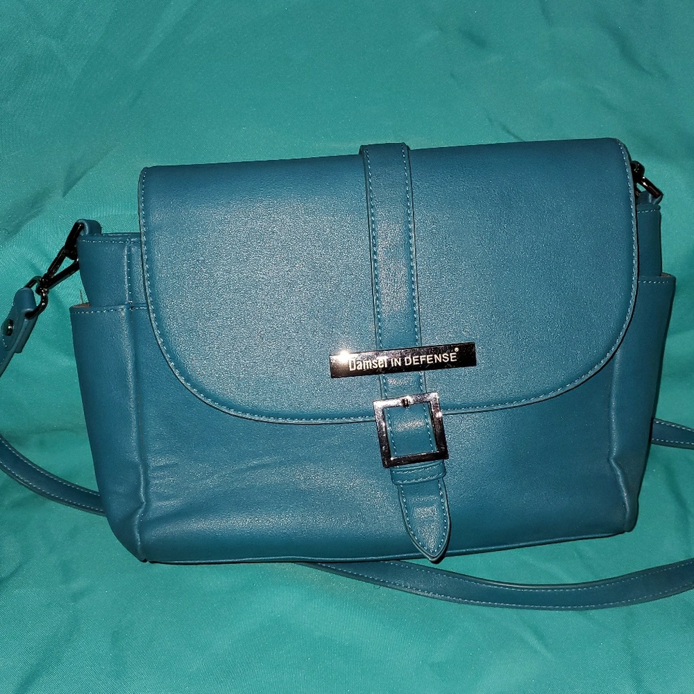 Damsel in Defense Teal Crossbody Bag